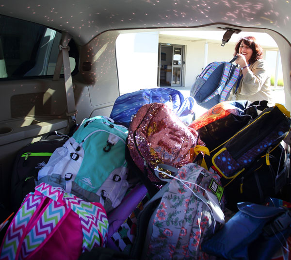 Adina Eliassian loading backpacks