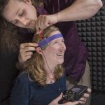 BRAINSTORM — Mike Trumbo puts the transcranial direct current stimulation (tDCS) headset on Laura Matzen. 