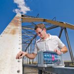 scientist positions monitor on bridge