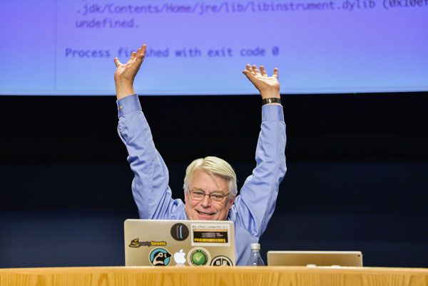 Robert C. Martin enthusiastically talks to a rapt audience