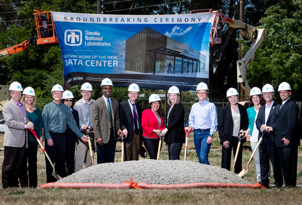 leadership poses with shovels at new data center site