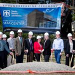 leadership poses with shovels at new data center site