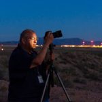 Sandia photojournalist Randy Montoya works with his camera