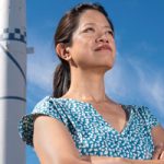 Frances Chance poses with missile in background