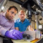 scientists work on battery materials