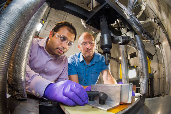 scientists work on battery materials