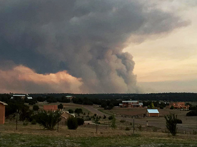 Says Jason Shelton, who took this picture on June 15 from his backyard just west of Edgewood:"My family and I are fortunate, as the fire changed paths and didn't affect us. I know a lot of families werenot so lucky."