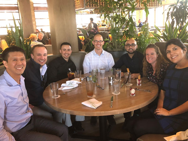 Graduates of Sandia's Future Leaders Pathway enjoy lunch together