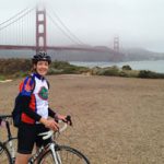 Marie Kane bikes near the Golden Gate Bridge