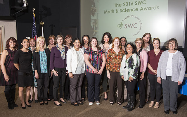 MAKING AN IMPRESSION — Guest speaker Celeste Rohlfing, third from left, front row, is joined by the organizers, speakers, and mentors involved in this year’s Math and Science Awards ceremony recognizing young women from San Francisco Bay area high schools. Rohlfing, chief operating officer of the American Association for the Advancement of Science, worked at Sandia for more than a decade and was one of the founders of the award 25 years ago.