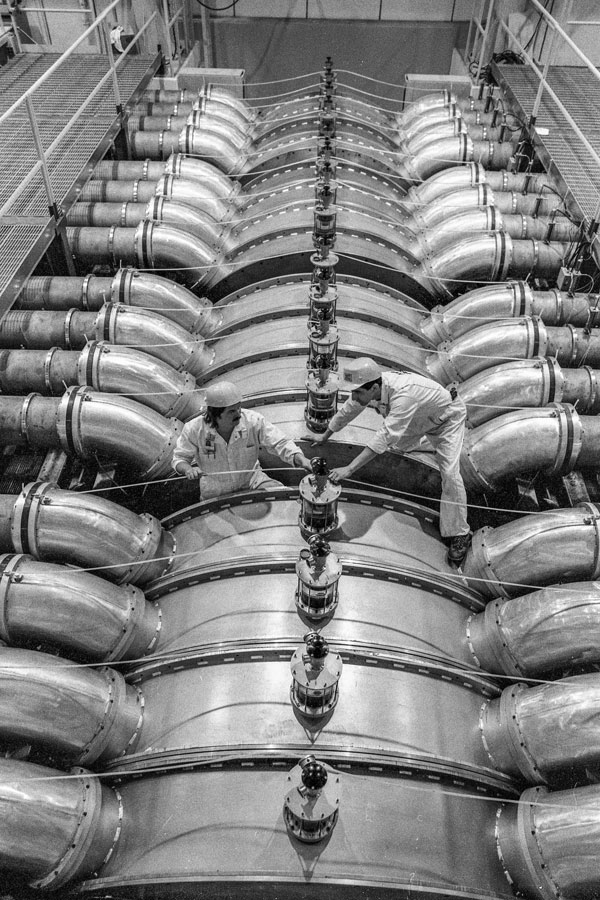 Technicians work on top of machinery