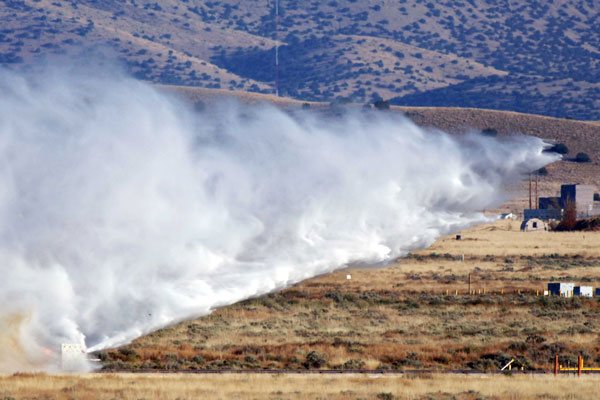 huge cloud of dust follows test unit along sled track