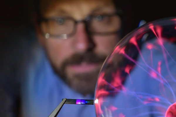Paul Davids works with a tiny silicon heat converter