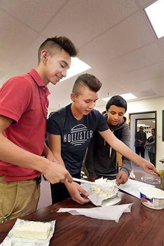 A math project at the tech high school included cake baking. The approach to education is interdisciplinary, pulling subjects like algebra, physics, and language arts into a single, hands-on assignment.