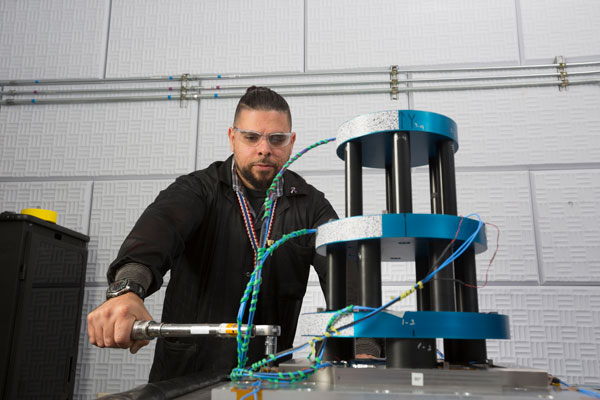 Ralph Lied-Lopez works on wedding cake mechanical model