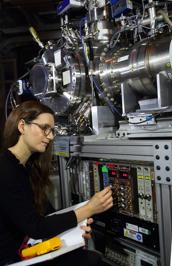 Scientist adjusts the Sandia Multiplexed Photo-ionization Mass Spectrometer