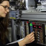 Scientist adjusts the Sandia Multiplexed Photo-ionization Mass Spectrometer