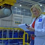 IAEA inspector checks list in nuclear facility