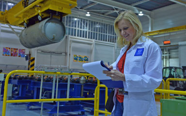IAEA inspector checks list in nuclear facility