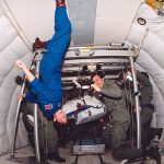 Laurel Salton-Clark and Jon Salton float on a training aircraft