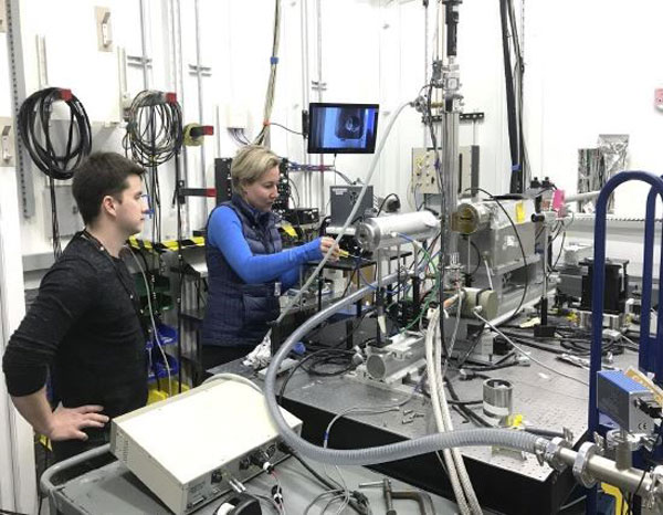 scientists set up experiment in photon lab