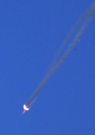 SPIN ROCKET MOTORS engage as a B61-12 bomb drops to the ground during one of three successful flight tests last year. (Photo courtesy of the B61-12 team)