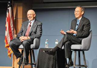 Image of <p>SECRETARY OF ENERGY Steven Chu, right, and Labs Director Paul   Hommert share a light moment at the Steve Schiff Auditorium during a   town hall meeting with members of the workforce. During his late-January   visit to Sandia, Chu also toured Sandia’s solar facility, conducted a   roundtable discussion with Sandia business partners, and conducted a   news conference with members of the local media. <a href="/news/publications/labnews/archive/_assets/images/12-10-02/pic1lg.png">View large image</a>. (Photo by Randy   Montoya)</p>