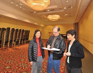 PLANNING TEAM —Sandians (left to right) Chui Fan Chen Cheng (2661), Eliot Fang (1524), and Tammy Strickland (9512) go over plans for the 2012 Asian American Engineer of the Year Award meeting and banquet to be held March 2-3 at the Albuquerque Marriott Uptown. “This has been a great experience,” says Eliot, chair of the event’s Executive Committee. (Photo by Randy Montoya)