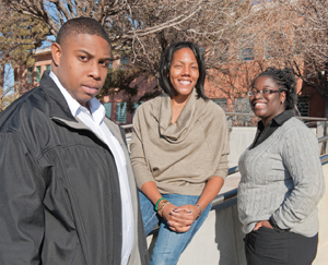 LIVING LEGACY Sandians, left to right, Melvin Bennett (10626), Patrice Gregory (0422), and Lydia Coleman (10694) recall the impact Dr. Martin Luther King Jr. had on their lives and the lives of their families.	(Photo by Randy Montoya)