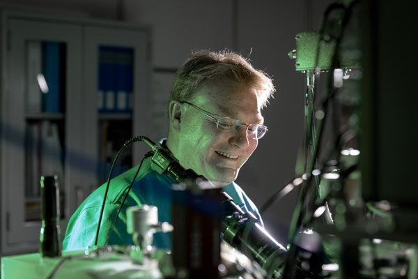 Ed Bielejec examines a material at the Ion Beam Laboratory