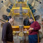 Sandia's Tito Bonano shares his knowledge on energy research with Efrain O’Neill, electrical engineering professor 