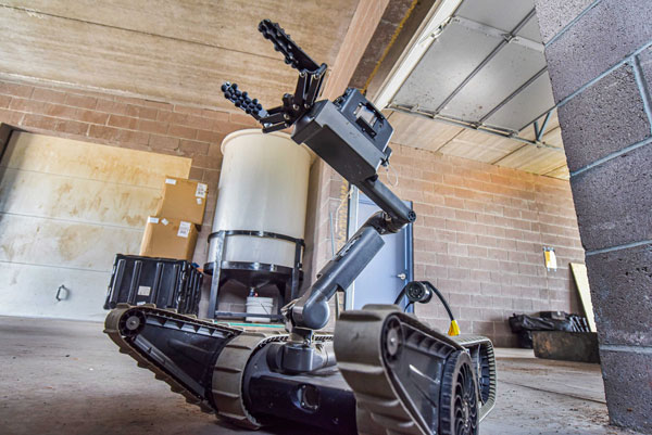 A robot maneuvers through a Sandia training facility