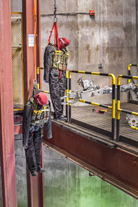 A robot completes a challenge that involves mannequins hanging with mock explosives