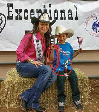 Sandia technical intern Cami Belcher and an Exceptional Rodeo cowboy share a moment at the New Mexico State Fair Sept. 15, 2015. Cami loves the Exceptional Rodeo — a mini rodeo for children with special needs. (Photo courtesy of Cami Belcher)