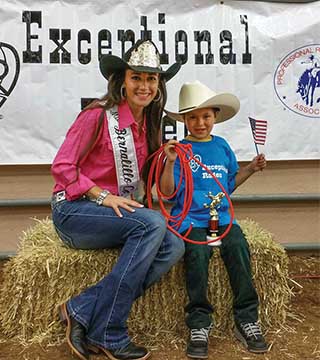 Caption SANDIA TECHNICAL INTERN Cami Belcher (1853) and an Exceptional Rodeo cowboy share a moment at the New Mexico State Fair Sept. 15, 2015. Cami loves the Exceptional Rodeo — a mini rodeo for children with special needs.	(Photo courtesy of Cami Belcher)