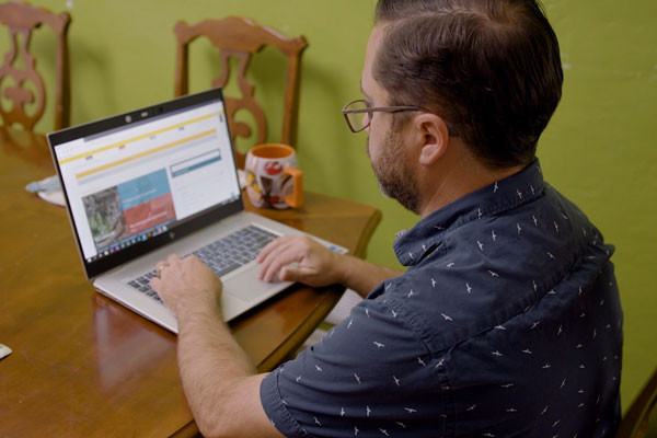 man working from home on laptop