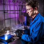 Sandia researcher Joey Carlson demonstrates the ease of casting an organic glass scintillator, 