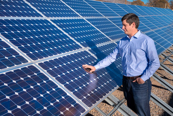 engineer inspects solar panels