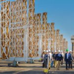 Executives tour solar tower facility