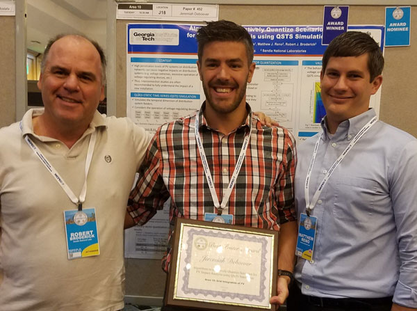 engineering team poses with award certificate