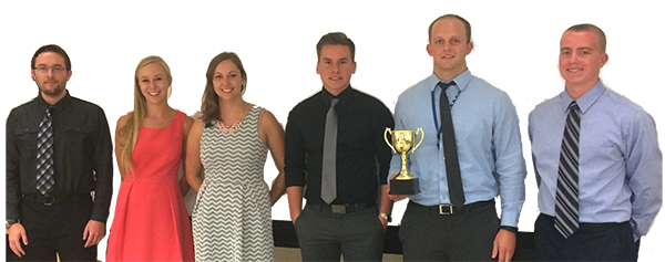 CHALLENGE WINNERS — Student members of the NW SPRINT winning team pose with their trophy after challenge pose after judging Aug. 4. Three intern teams, augmented by Sandia staff, spent eight weeks this summer designing a nuclear weapon component, building it with additive manufacturing techniques, and testing it on a centrifuge. (Photo by Tommy Woodall)