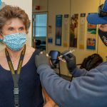 Deputy Labs Director Dori Ellis receives a COVID-19 vaccine