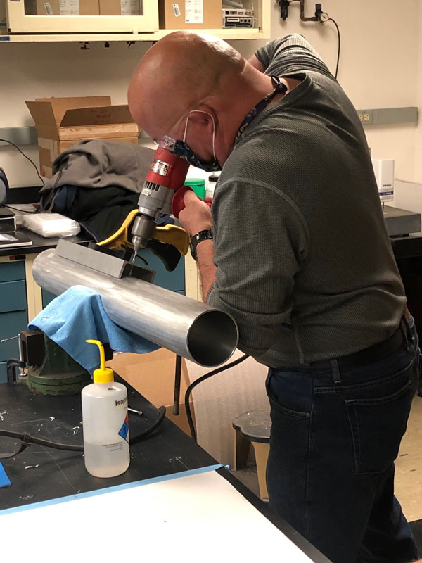 researcher working on ventilator kit