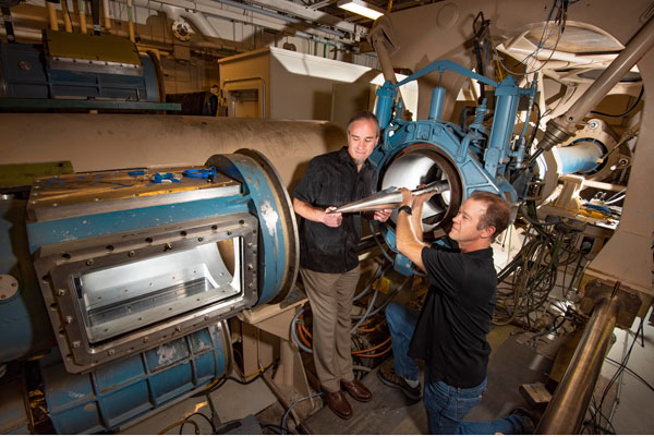 Sandia aerosciencists place a model in the hypersonic wind tunnel’s test section