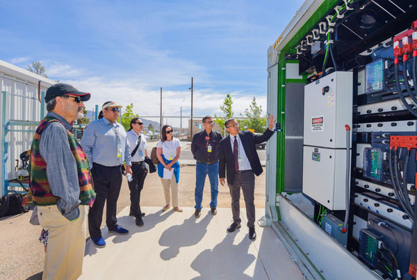 Power electronics researcher Stan Atcitty leading members of the DOE Indian Country Energy and Infrastructure Working Group at Sandia’s Energy Storage Test Pad.