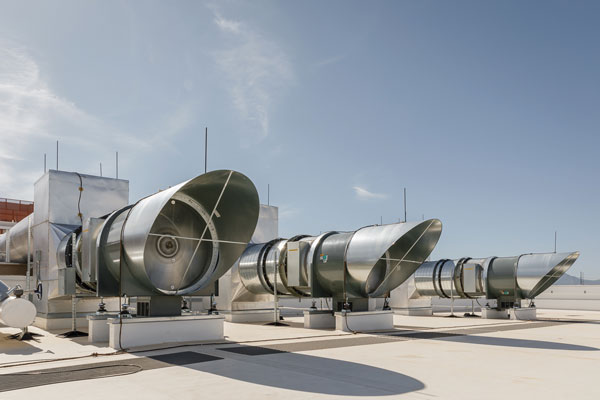 HOT AIR — When the air temperature nears 100 degrees, the Airside Economizer system’s giant exhaust fans vent hot air from the facility and pull in fresh air.