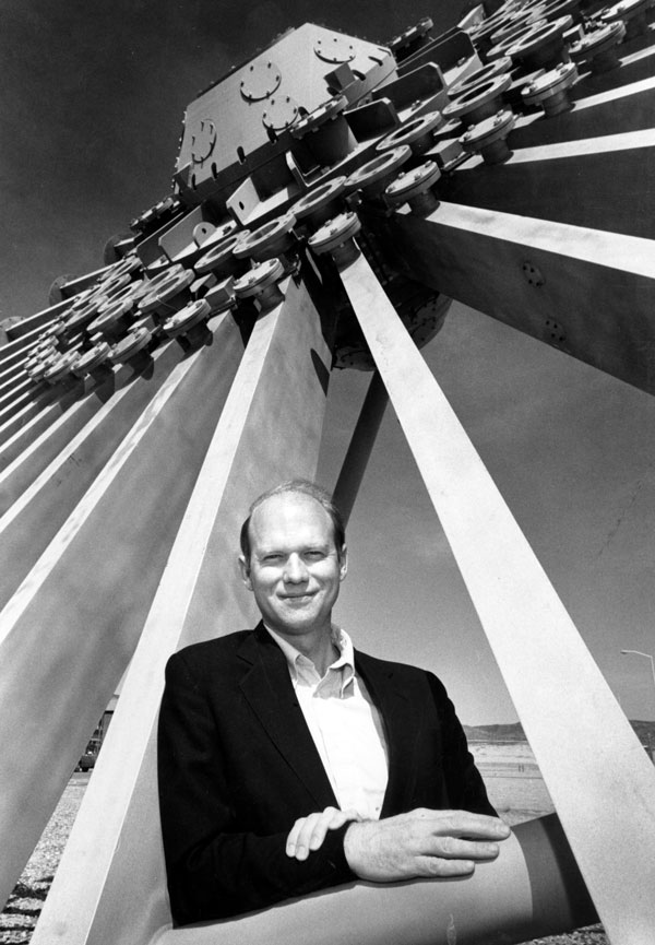 STARBURST — VanDevender is shown in a 1992 file photo at the Starburst sculpture in Technical Area 4, which once was the power flow section of Particle Beam Fusion Accelerator I, and was removed when the accelerator was converted into the Saturn X-ray simulator. (Lab News file photo)