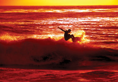 Harnessing the energy of a wave can do many things: propel a surfer toward shore or serve as a source of virtually limitless energy for 21st century America. (Photo by Randy Montoya)