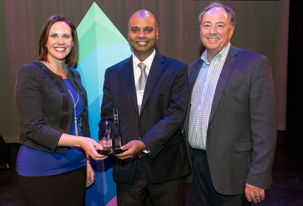 INNOVATORS – Sandia’s Stephanie Beasly, left, and Anup Singh, center, receive Sandia’s Founders Award from Buck Koonce, Economic Development Director at Lawrence Livermore National Laboratory. Lawrence was the recipient of the 2017 Founders Award. (Photo courtesy of ITVLG)