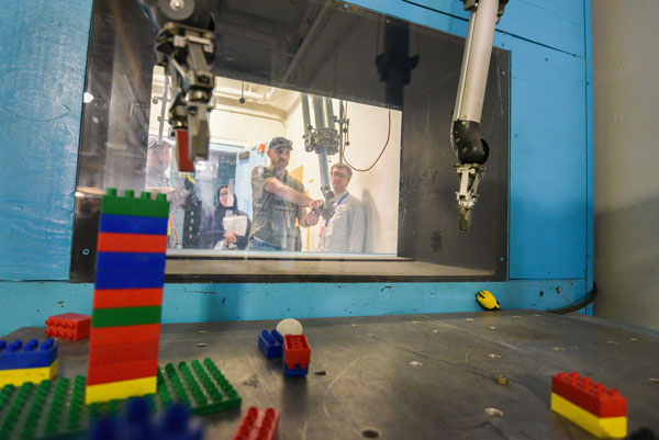 ITC participants practice using telemanipulators.